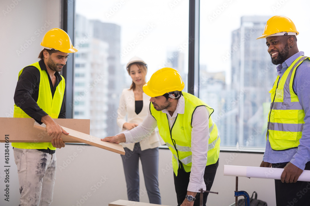 Group of Asian engineer with multicultural people discussion about construction process of the building. Group of Asian engineer with multicultural people discussion about construction process of the building.