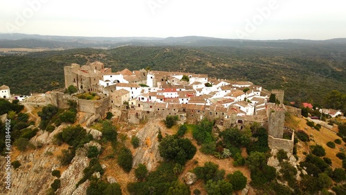 aerial view of Castillo de Castellar, medieval town within a castle in Andalusia at a cloudy day, Castellar de la Frontera, province of Cádiz, Spain