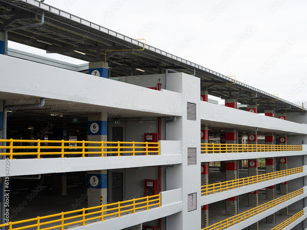 Multilevel parking garage. Indoor car park building. Urban parking structure. Multistory car