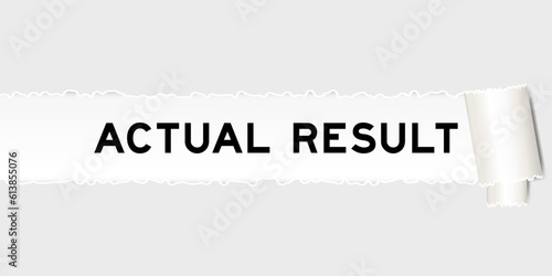 Ripped gray paper background that have word actual result under torn part