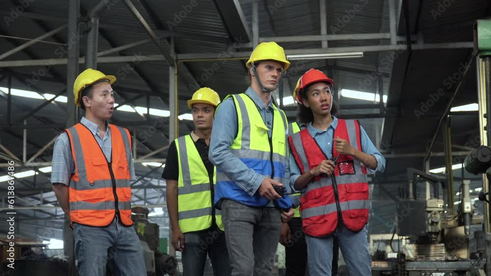 group of diversity Factory asian worker with Industrial Engineer inspector and african american manager woman visit and checking mechanical in Manufacturing Facility. teamwork meeting training discuss group of diversity Factory asian worker with Industrial Engineer inspector and african american manager woman visit and checking mechanical in Manufacturing Facility. teamwork meeting training discuss