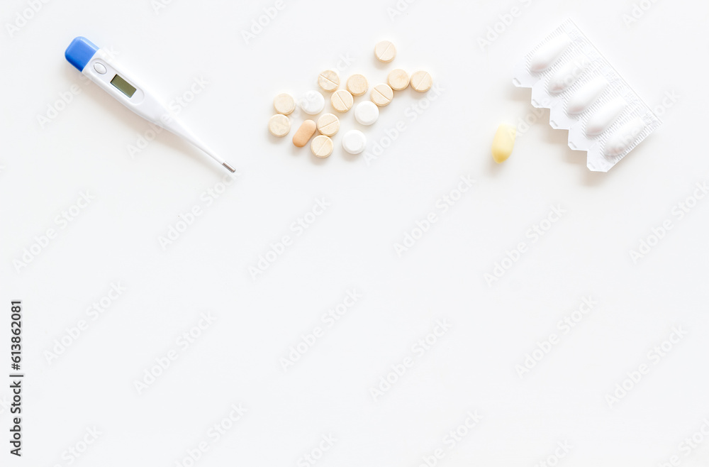 Thermometer with rectal suppositories and pills for medical treatment Thermometer with rectal suppositories and pills for medical treatment
