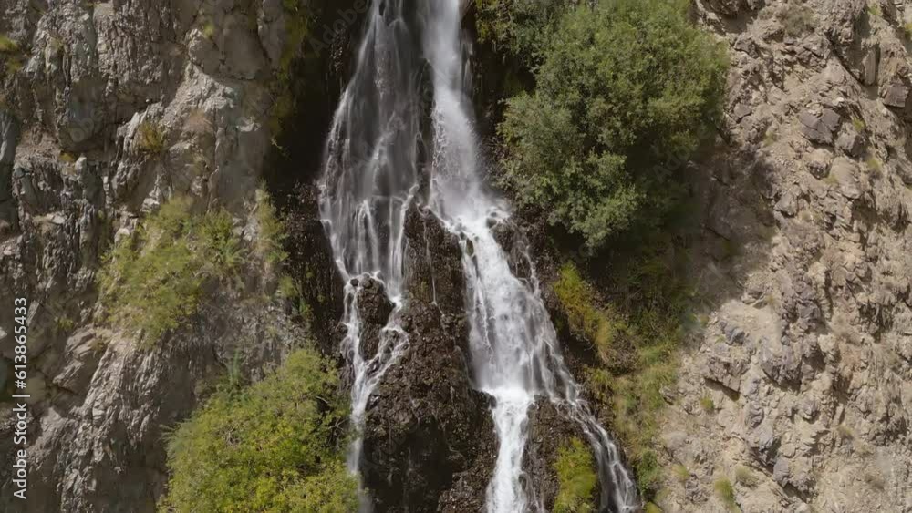 Aerial top view of Mantoka Waterfall in Karakoram high mountain hills. Nature landscape background, Skardu-Gilgit, Pakistan. Travel on holiday vacation. Aerial top view of Mantoka Waterfall in Karakoram high mountain hills. Nature landscape background, Skardu-Gilgit, Pakistan. Travel on holiday vacation.