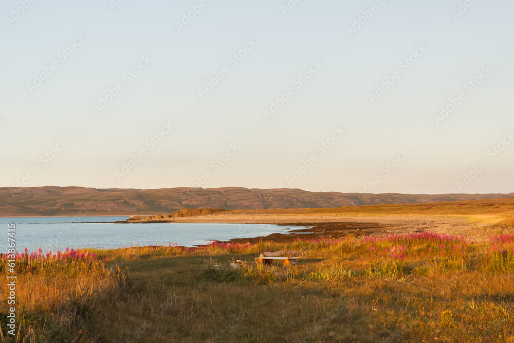 Background on the Rybachy peninsula. The Barents Sea. Sunset on the sea