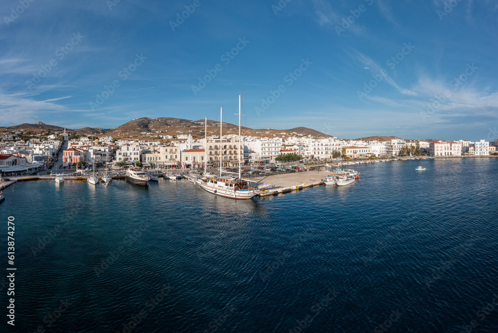 Tinos island Hora town Cyclades Greece. Aerial drone view of port, sea, blue sky, summer holiday.