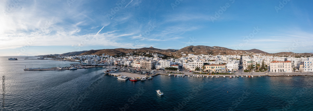 Greece Tinos island Hora town Cyclades. Aerial drone panoramic view of port, sea blue sky. Banner