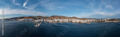 Fototapeta Naklejka Na Ścianę i Meble -  Tinos island Hora town Cyclades Greece. Aerial drone panoramic view of harbor, sea blue sky. Banner