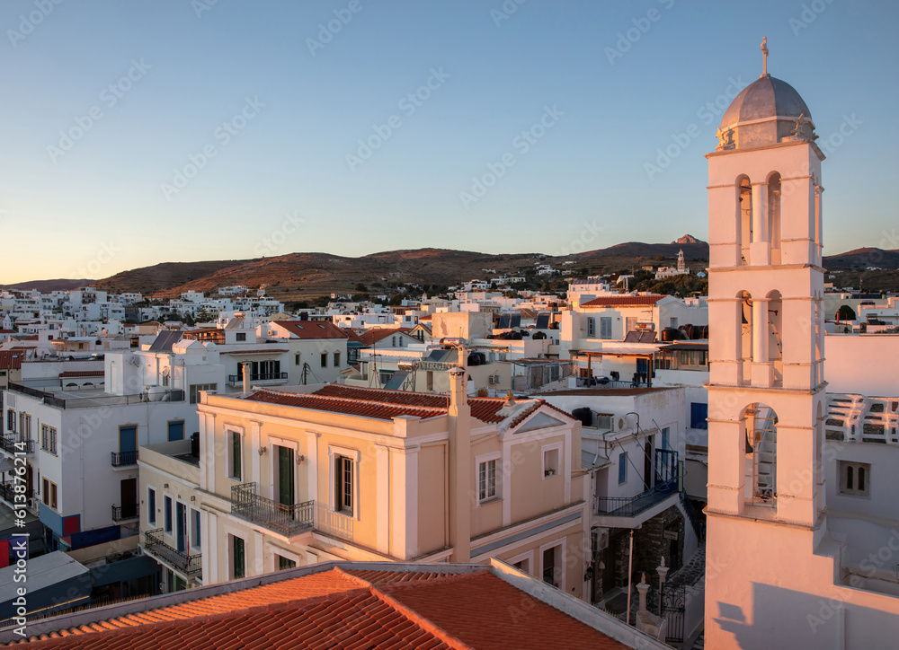 Tinos island Chora Cyclades Greece. Sunbeam colors Panagia Megalohari Church Belfry and building.