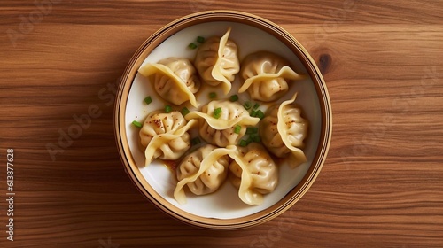 Traditional japaneese gyoza dumplings with  chopped green onions in ceramic bowl on wooden table. Top view. AI generated