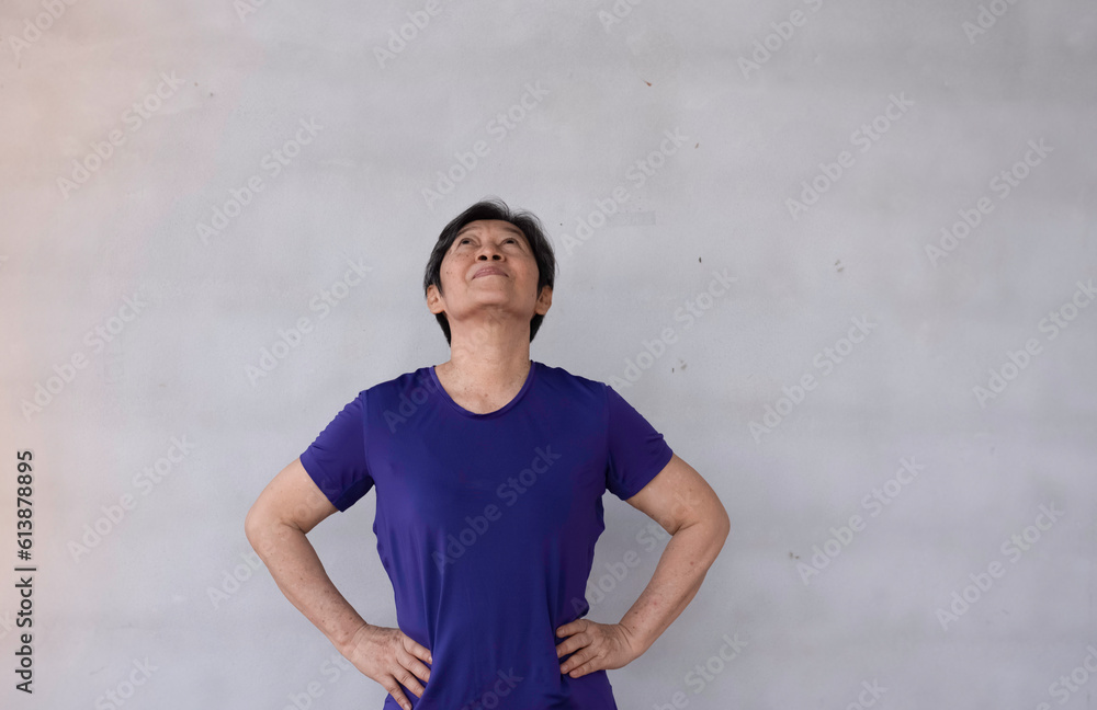 Old lady put hand on her waist,turn face upward ,for stretching body and neck muscle, Old lady put hand on her waist,turn face upward ,for stretching body and neck muscle,