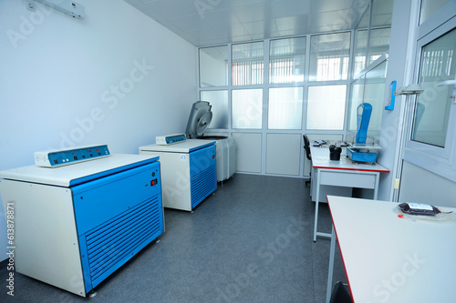 centrifuges set in the hospital lab room, scales, containers with blood