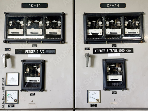 Foto Two feeders of medium voltage protection relay panel : Electromechanical protection relay and analog meter on board, such as Overcurrent relay, Earth fault relay, and Amp meter, Watt-hour meter