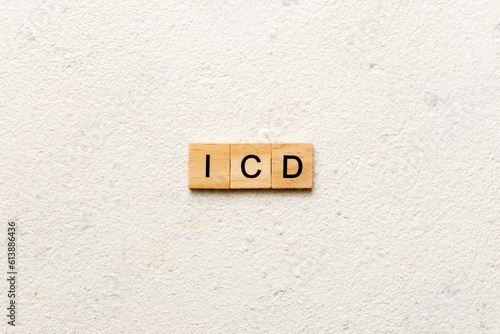 icd word written on wood block. international classification diseases text on table, concept photo