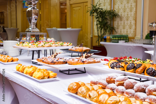 a buffet table with a variety of pastries on it. hotel conference coffee break idea