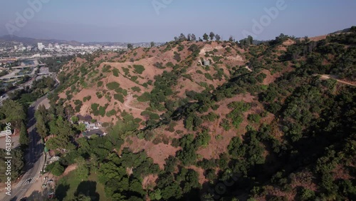 Drone and aerial view of mountain landscape and forests near Griffith Park and Hollywood hills outside Los Angeles, California