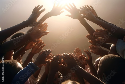 Charity. Close up of african people raising hands together. World humanitarian day concept