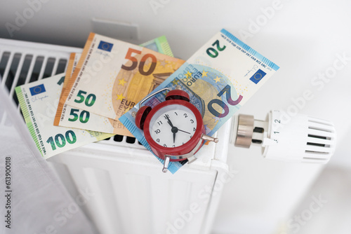 Cost of heat energy. Price of gas in winter. Money and rising prices in winter. Europe during winter season. Expensive life and heating bills. Euro banknotes on a cold radiator. 