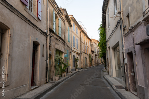 Fototapeta Naklejka Na Ścianę i Meble -  View on old streets and houses in ancient french town Arles, touristic destination with Roman ruines, Bouches-du-Rhone, France