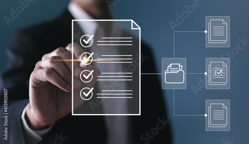 Electronic smart checklist and document on virtual screens concept, business people check electronic documents on digital documents, paperless offices,working on borderless communication technology