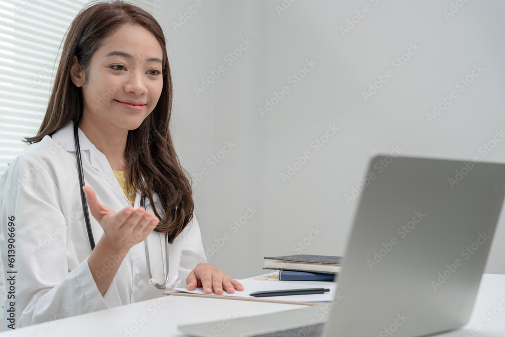 telemedical. Doctors are advising patients over the Internet by video conference. Asian doctor is treating patients through telecommunication while describing the disease . Technology for health. telemedical. Doctors are advising patients over the Internet by video conference. Asian doctor is treating patients through telecommunication while describing the disease . Technology for health.