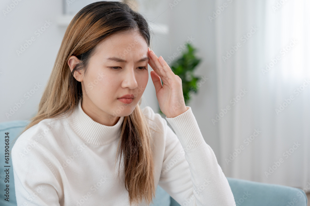 Headache, female having migraine pain, bad health, Asian woman feeling stress and headache, Office syndrome, sad tired touching forehead having migraine or depression, irritated girl, sadness grief Headache, female having migraine pain, bad health, Asian woman feeling stress and headache, Office syndrome, sad tired touching forehead having migraine or depression, irritated girl, sadness grief