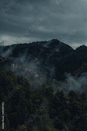 Beautiful view of mountains in the fog - scenic view of Shimla hills on a rainy day - Shimla hill station