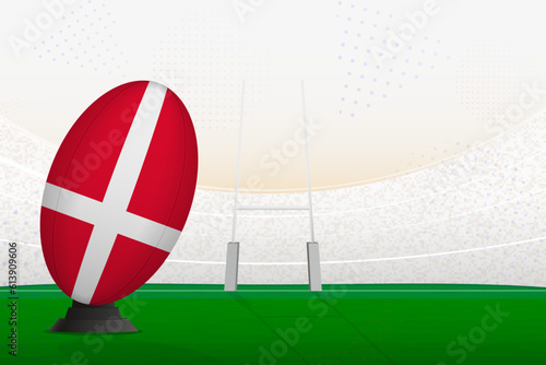 Denmark national team rugby ball on rugby stadium and goal posts, preparing for a penalty or free kick.