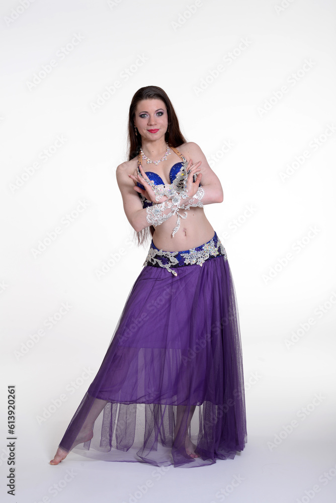Belly dancer woman studio photography, belly dance is an art form of the dance.