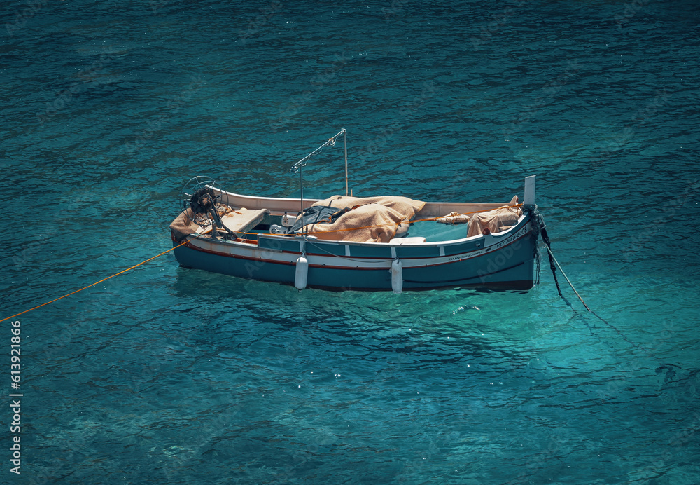 small fisherboat in the blue ocean