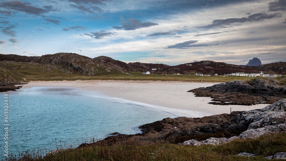 Achmelvich Beach in the North West Highlands of Scotland with the majestic Suilven in the distance. Achmelvich Beach in the North West Highlands of Scotland with the majestic Suilven in the distance.