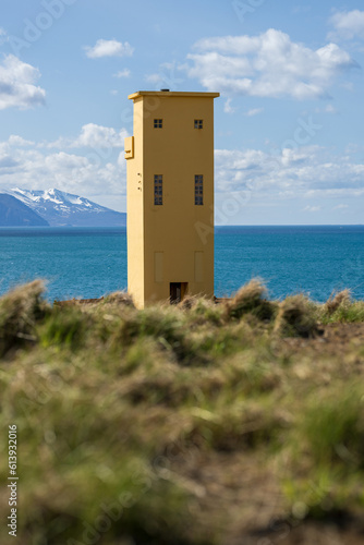 Lighthouse on iceland near husavik with view over skjalfandi bay photo
