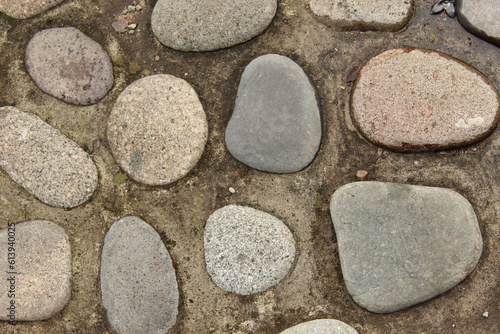 Fountain of pink, gray and light blue stones, with water between them