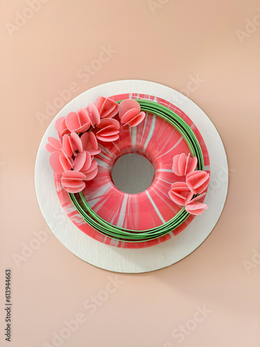 top view of mousse glaze cake with festive decor. vertical shot.