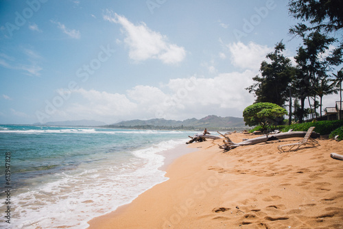 The sand and water of Wailua Beach on the island of Kauai, Hawaii on a clear blue day with no people