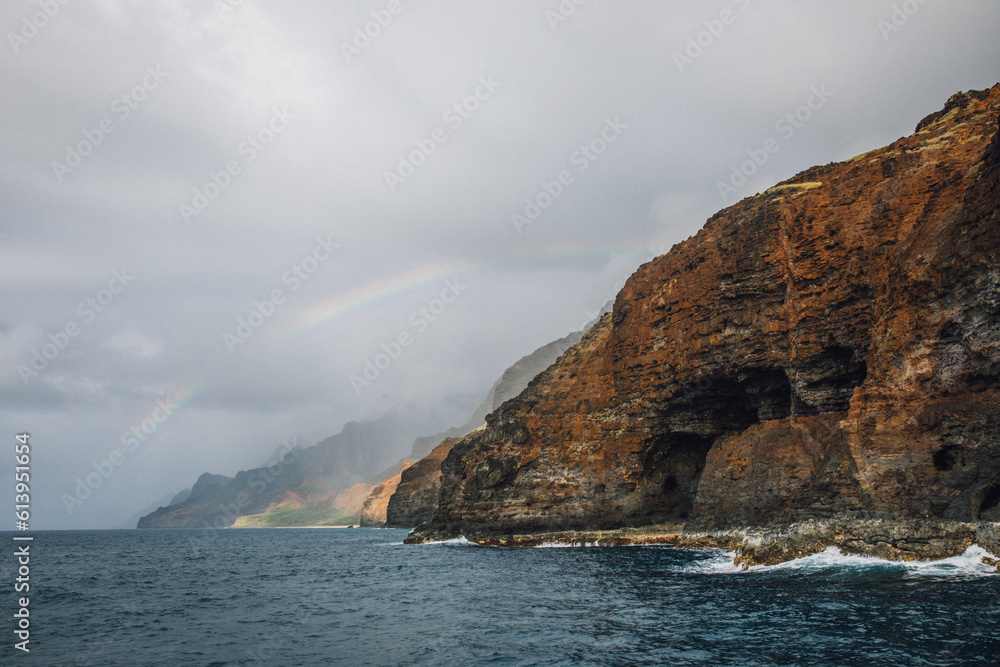 Rainbow over the mountains of the NaPali coast on the island of Kauai, Hawaii from a sunset cruise Rainbow over the mountains of the NaPali coast on the island of Kauai, Hawaii from a sunset cruise