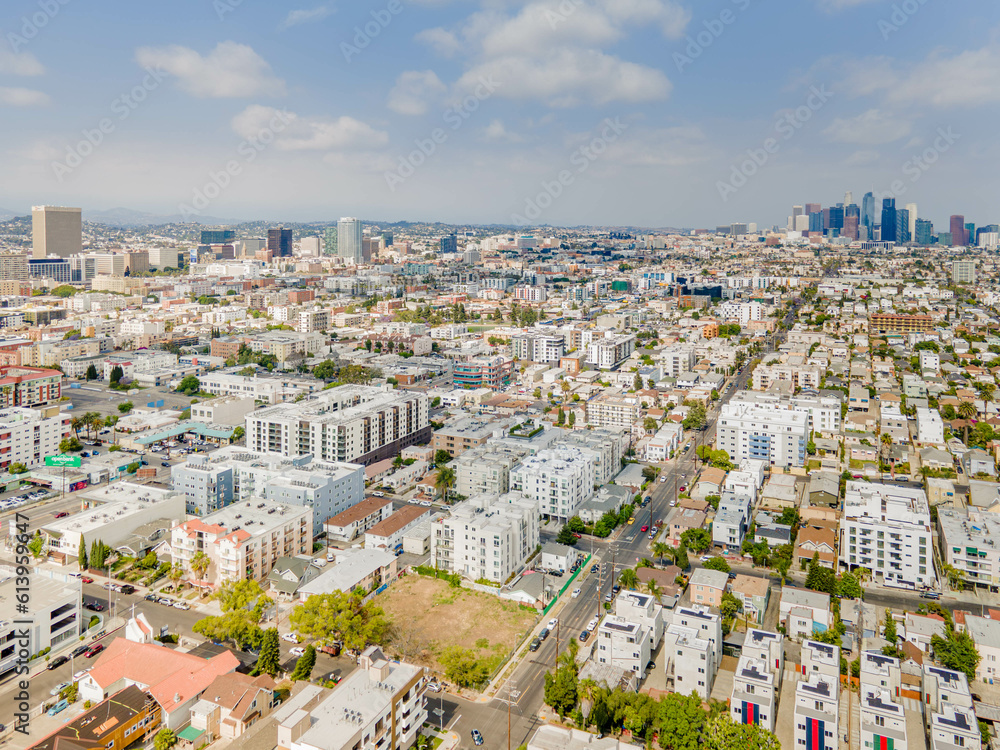 Los Angeles, California - June 13, 2023: aerial drone view toward LA downtown buildings above Olympic Blvd, Western Ave, Vermont Ave near Koreatown