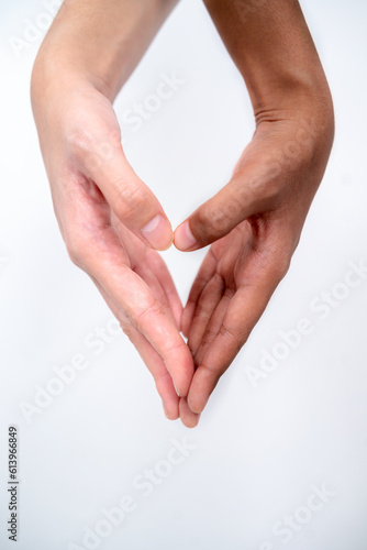 two hands holding make heart