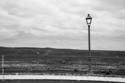 Lanzarote landscape in black and white. Lantern on the pavement. 