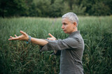 woman doing tai chi practice in nature