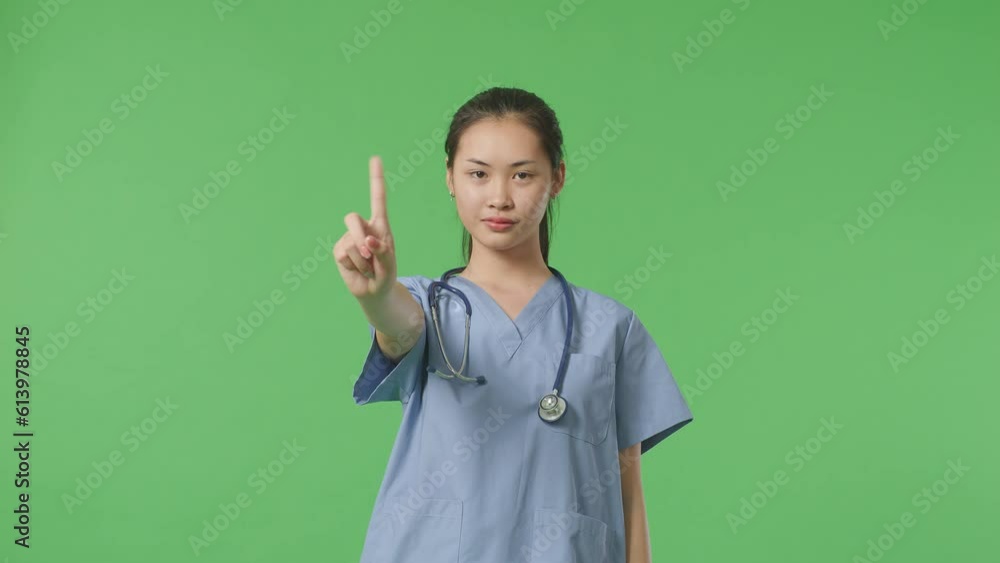 Asian Female Doctor With Stethoscope Showing No Gesture While Standing On Green Screen Background In The Hospital
Asian Female Doctor With Stethoscope Showing No Gesture While Standing On Green Screen Background In The Hospital