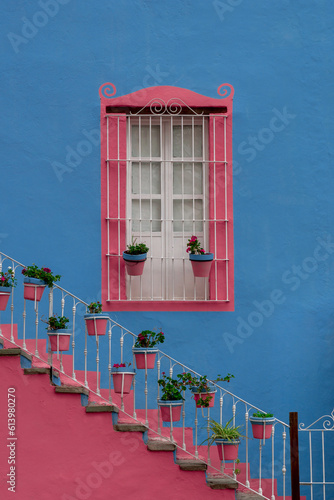 Mexican Classic Colonial Style Window and stairs, pink and blue colors in Guanajato Mexico.