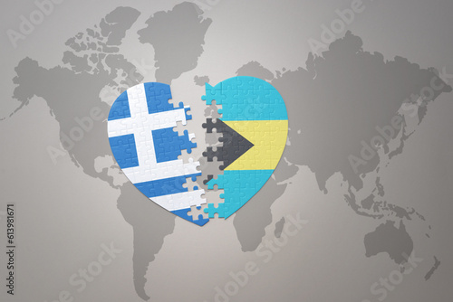 puzzle heart with the national flag of bahamas and greece on a world map background.Concept.