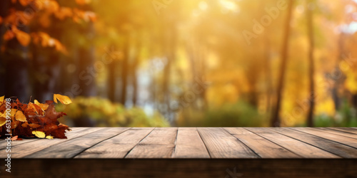 autumn background with golden yellow bokeh and wooden ground