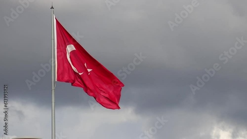 A Shot of a Turkish Flag Waving Against Cloudy Sky.for Turkish national holidays photo