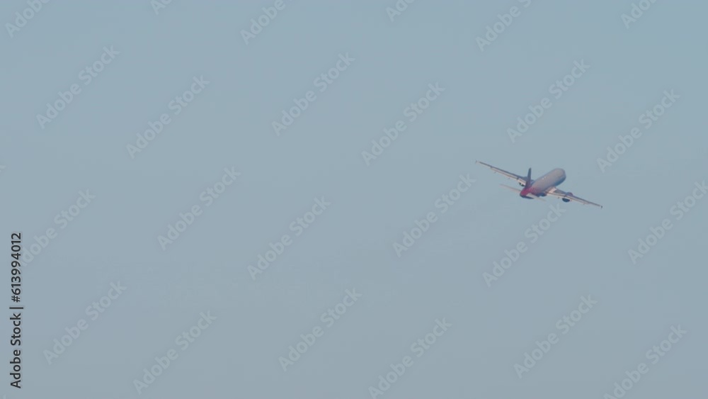 Rear view of a jet passenger plane taking off, climbing. Commercial aircraft fly away. Flight departure. Tourism and travel concept Rear view of a jet passenger plane taking off, climbing. Commercial aircraft fly away. Flight departure. Tourism and travel concept