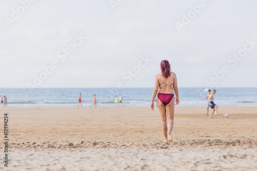 Summer swimwear body inclusivity unaltered imagery at the beach. Latin mid Unrecognizable female 