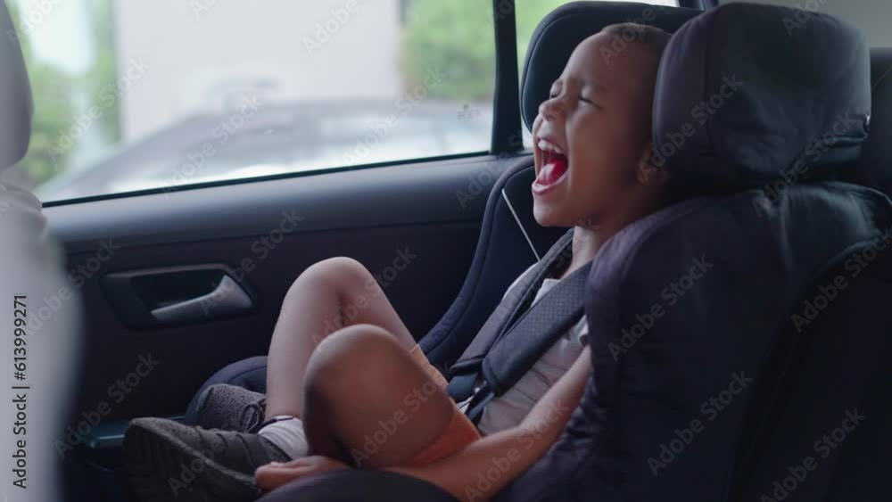 Boy screaming sitting in a car interior
Boy screaming sitting in a car interior