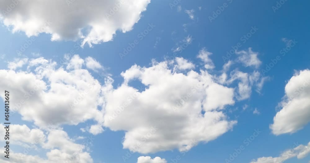 Blue summer sky with fluffy clouds forming. White clouds appear and disappear in the atmosphere. Low angle view. Timelapse. Blue summer sky with fluffy clouds forming. White clouds appear and disappear in the atmosphere. Low angle view. Timelapse.