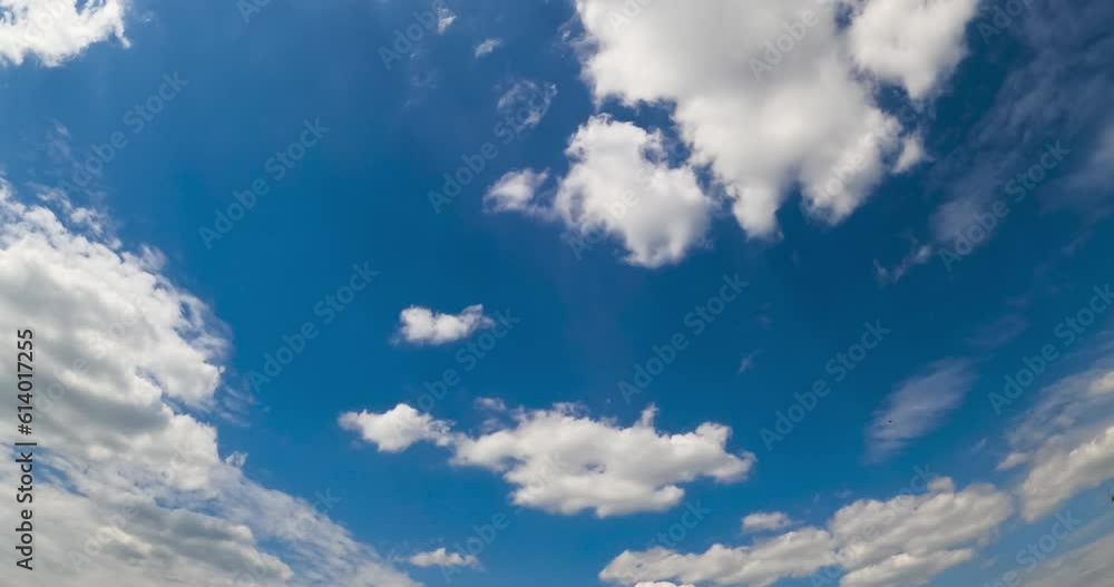 Amazing summer sky with soft fluffy clouds. Stratus cloudscape flying at backdrop. Low angle view. Timelapse. Amazing summer sky with soft fluffy clouds. Stratus cloudscape flying at backdrop. Low angle view. Timelapse.