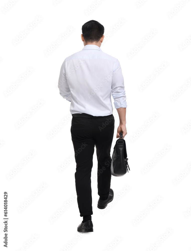 Naklejka premium Businessman with briefcase walking on white background, back view